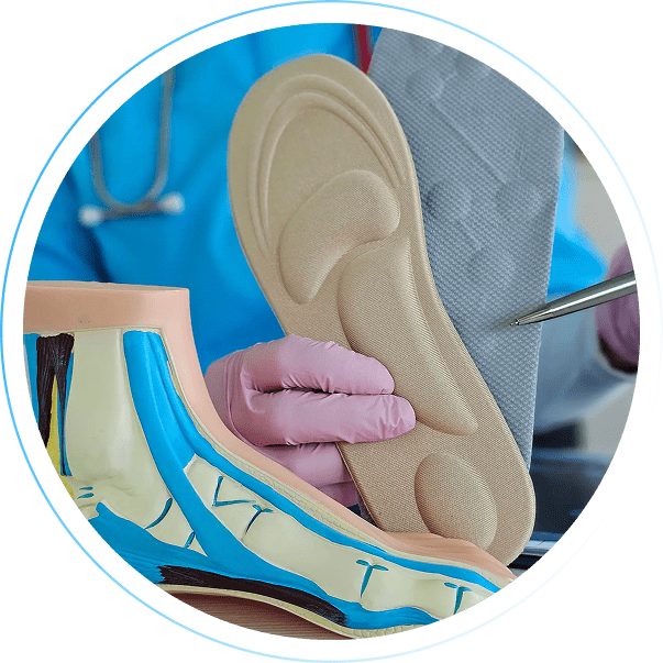 A doctor examining shoe insoles with a stethoscope.